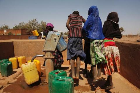 Girls draw water from a fountain at a dispensary in Nedogo village near Ouagadougou, Burkina Faso, February 16, 2018. PHOTO BY REUTERS/Luc Gnago
