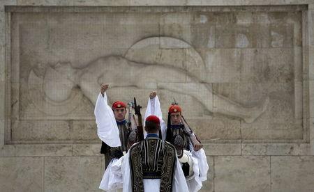 Greek Presidential guards take part in a ceremonial change of guards at the Monument of the Unknown Soldier in front of the Parliament building in Athens, Greece, August 23, 2015. PHOTO BY REUTERS/Stoyan Nenov