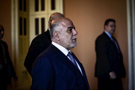 Iraqi Prime Minister Haider al-Abadi walks to a meeting with the Senate leadership at the U.S. Capitol in Washington, April 15, 2015. PHOTO BY REUTERS/James Lawler Duggan