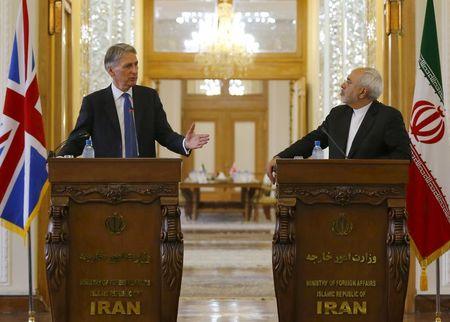 Britain's Foreign Secretary Philip Hammond (L) and Iran's Foreign Minister Mohammad Javad Zarif speak during a news conference at the Ministry of Foreign Affairs in Tehran, Iran, August 23, 2015. PHOTO BY REUTERS/Darren Staples