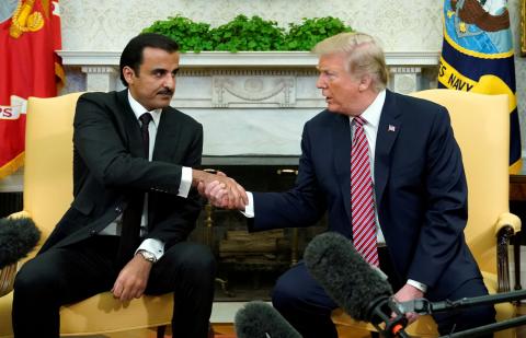U.S. President Donald Trump meets Qatar's Emir Sheikh Tamim bin Hamad al-Thani in the Oval Office at the White House in Washington, DC, U.S., April 10, 2018. PHOTO BY REUTERS/Kevin Lamarque