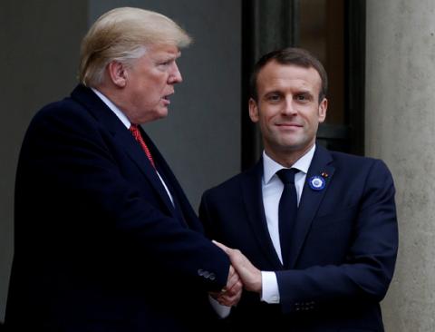 French President Emmanuel Macron shakes hands with U.S. President Donald Trump after a meeting at the Elysee Palace on the eve of the commemoration ceremony for Armistice Day, 100 years after the end of the First World War, in Paris, France, November 10, 2018. PHOTO BY REUTERS/Vincent Kessler