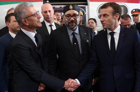 French President Emmanuel Macron shakes hands with Mohamed Rabie Khlie, general director of Office National des Chemins de Fer (ONCF), next to Moroccan King Mohammed VI, after the inauguration of a high-speed line at Rabat train station, in Rabat, France, November 15, 2018. PHOTO BY REUTERS/Christophe Archambault