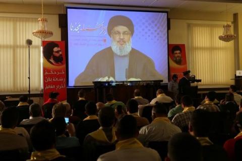 Lebanon's Hezbollah leader Sayyed Hassan Nasrallah addresses his supporters from a screen during a rally to commemorate Hezbollah Wounded Veterans Day in Beirut's southern suburbs, Lebanon, May 12, 2016. PHOTO BY REUTERS/Aziz Taher