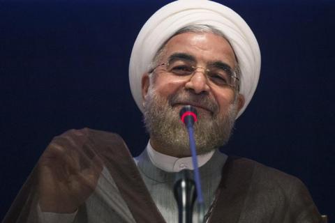 Iran's President Hassan Rouhani smiles while replying to a question during a news conference on the sidelines of the 69th United Nations General Assembly at United Nations Headquarters in New York, September 26, 2014. PHOTO BY REUTERS/Adrees Latif