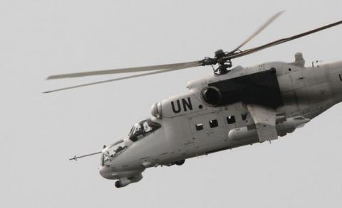 A U.N. MI-24 helicopter flies in Abidjan. PHOTO BY REUTERS/Luc Gnago