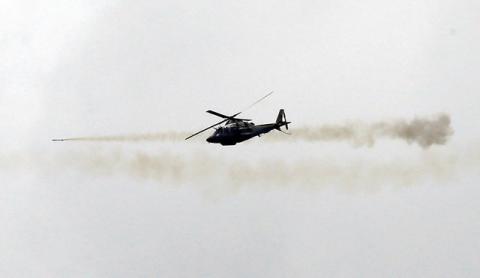 A Philippine Air Force attack helicopter fires a rocket as they continue to assault the Maute group in Marawi city, Philippines, May 31, 2017. PHOTO BY REUTERS/Romeo Ranoco