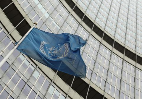 The flag of the International Atomic Energy Agency (IAEA) flies in front of its headquarters in Vienna
