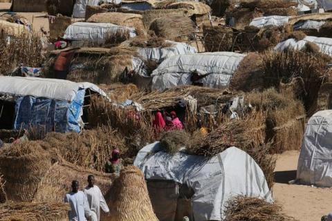 People are seen next to their thatched homes at the Muna Internally displace peoples camp in Maiduguri, Nigeria, December 1, 2016. PHOTO BY REUTERS/Afolabi Sotunde