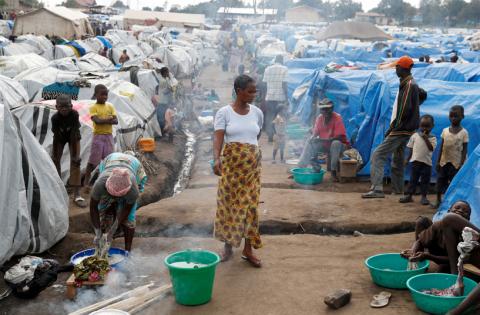 A woman walks at an internally displaced persons (IDP) camp in Bunia, Ituri province, eastern Democratic Republic of Congo, April 12, 2018. PHOTO BY REUTERS/Goran Tomasevic