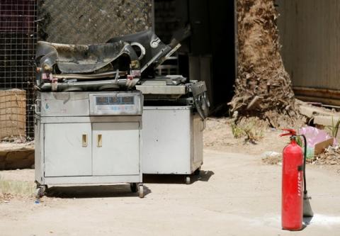 Burnt incubators stand outside a maternity ward after a fire broke out at Yarmouk hospital in Baghdad, Iraq, August 10, 2016. PHOTO BY REUTERS/Thaier Al-Sudani
