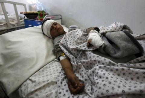 An injured boy receives treatment in a hospital after a suicide attack in Asadabad, capital of Kunar province, Afghanistan, February 27, 2016. PHOTO BY REUTERS/Parwiz