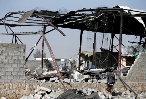 A guard inspects damage at a factory hit by a Saudi-led air strike in the Houthi-held capital Sanaa, Yemen, January 20, 2019. PHOTO BY REUTERS/Khaled Abdullah