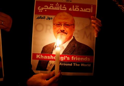 A demonstrator holds a poster with a picture of Saudi journalist Jamal Khashoggi outside the Saudi Arabia consulate in Istanbul, Turkey, October 25, 2018. PHOTO BY REUTERS/Osman Orsal