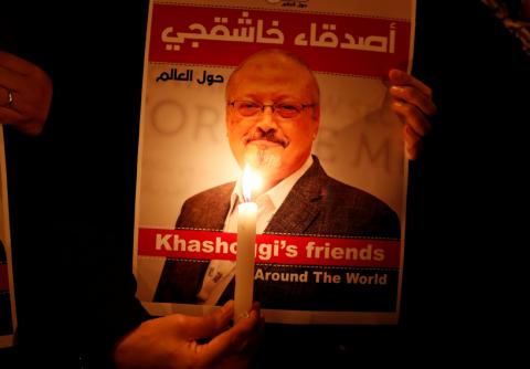 A demonstrator holds a poster with a picture of Saudi journalist Jamal Khashoggi outside the Saudi Arabia consulate in Istanbul, Turkey, October 25, 2018. PHOTO BY REUTERS/Osman Orsal