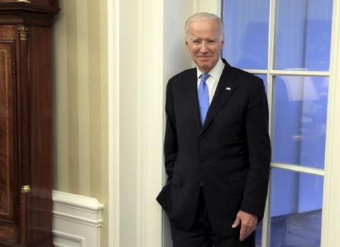 U.S. Vice President Joe Biden watches as U.S. President Barack Obama and Colombia's President Juan Manuel Santos speak during a bilateral meeting in the Oval Office of the White House in Washington, February 4, 2016. PHOTO BY REUTERS/Joshua Roberts