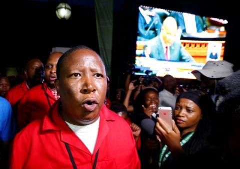 Economic Freedom Fighters (EFF) leader Julius Malema leaves the parliament after being ordered to do so during President Jacob Zuma's State of the Nation address in Cape Town, February 11, 2016. PHOTO BY REUTERS/Mike Hutchings