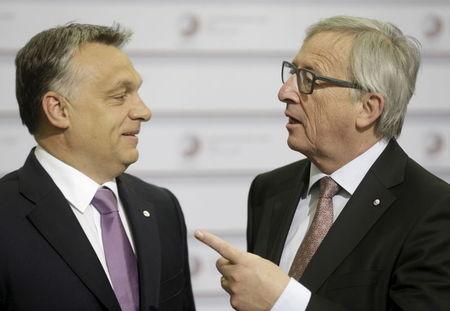 European Commission President Jean-Claude Juncker (R) speaks to Hungary's Prime Minister Viktor Orban before the Eastern Partnership Summit session in Riga, Latvia, May 22, 2015. PHOTO BY REUTERS/Ints Kalnins