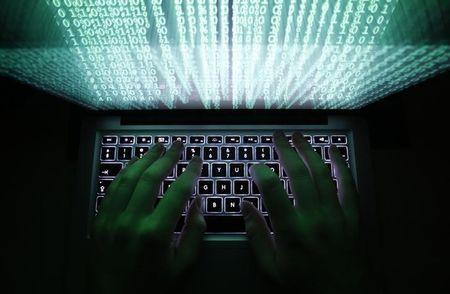 A man types on a computer keyboard in Warsaw in this February 28, 2013 illustration file picture. PHOTO BY REUTERS/Kacper Pempel