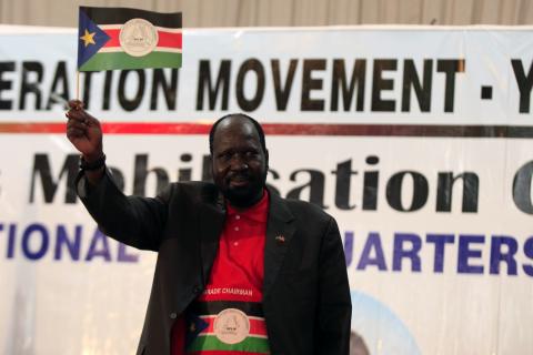 South Sudanese President Salva Kiir waves a miniature flag of South Sudan at a rally of the Sudan's People Liberation Movement (SPLM) youth in Juba