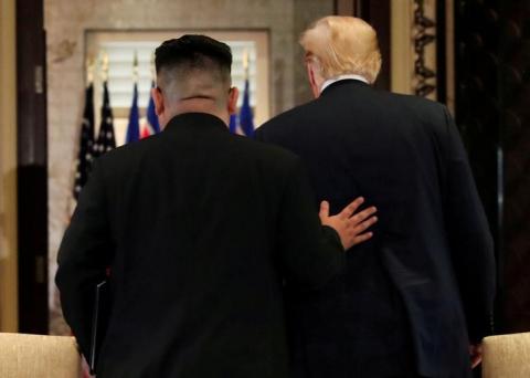 U.S. President Donald Trump and North Korea's leader Kim Jong Un leave after signing documents that acknowledge the progress of the talks and pledge to keep momentum going, after their summit at the Capella Hotel on Sentosa island in Singapore, June 12, 2018. PHOTO BY REUTERS/Jonathan Ernst
