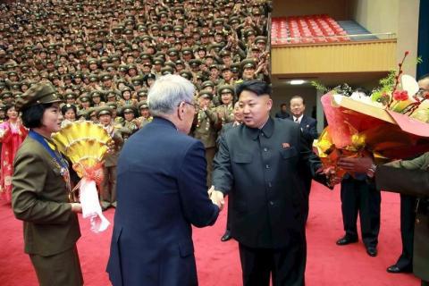 North Korean leader Kim Jong Un shakes hands during a photo session with participants in the 7th National Conference of Sportspersons in this undated photo released by North Korea's Korean Central News Agency (KCNA) in Pyongyang, March 27, 2015. PHOTO BY REUTERS/KCNA