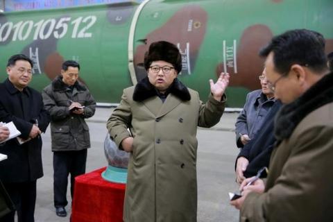 North Korean leader Kim Jong Un meets scientists and technicians in the field of research into nuclear weapons in this undated photo released by North Korea's Korean Central News Agency (KCNA) in Pyongyang March 9, 2016. PHOTO BY REUTERS/KCNA
