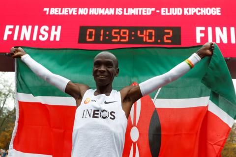 Kenya's Eliud Kipchoge, the marathon world record holder, celebrates after a successful attempt to run a marathon in under two hours. PHOTO BY REUTERS/Leonhard Foeger