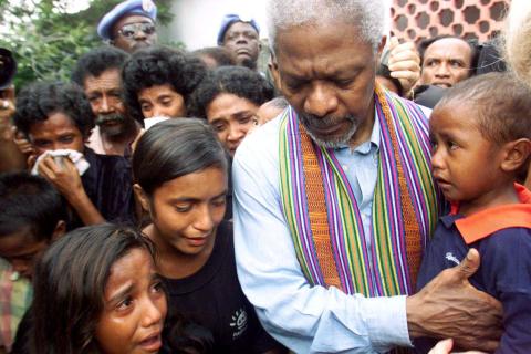 United Nations Secretary-General Kofi Annan consoles family members of victims of last April's massacre by pro-Indonesia militia in Liquisa, 30 km west of Dili, February 17, 2000. PHOTO BY REUTERS/Darren Whiteside