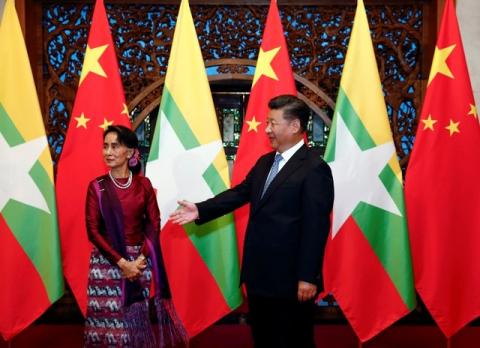 Myanmar State Counsellor Aung San Suu Kyi (L) and Chinese Premier Xi Jinping (R) wait for Myanmar delegates to arrive for a meeting at the Diaoyutai State Guesthouse in Beijing, China, August 19, 2016. PHOTO BY REUTERS/Rolex Dela Pena