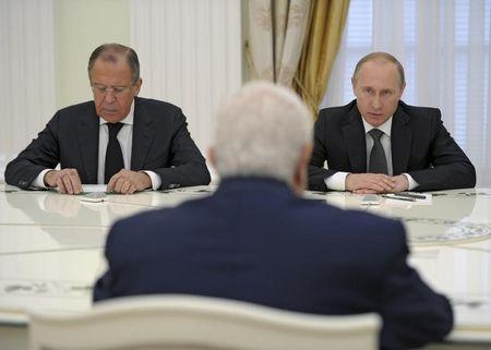 Russian President Vladimir Putin (R), Foreign Minister Sergei Lavrov (L) and Syrian Foreign Minister Walid al-Muallem (back to camera) attend a meeting at the Kremlin in Moscow, Russia, June 29, 2015. PHOTO BY REUTERS/Alexei Nikolsky