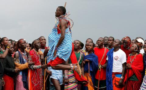 Tipape Lekatoo, a Maasai Moran from Mbirikani Manyatta, competes in a traditional high-jump event during the 2018 Maasai Olympics at the Sidai Oleng Wildlife Sanctuary, at the base of Mt. Kilimanjaro, near the Kenya-Tanzania border in Kimana, Kajiado, Kenya, December 15, 2018. PHOTO BY REUTERS/Thomas Mukoya
