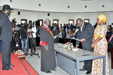 South Sudan's First Vice President Riek Machar stands with his wife Angelina Teny as he takes the oath of office in front of Sudan's President Salva Kiir and Chief of Justice Chan Reech Madut, at the State House in Juba, South Sudan, February 22, 2020. PHOTO BY REUTERS/Jok Solomun