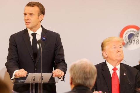 French President Emmanuel Macron delivers a speech as U.S. President Donald Trump looks on, before a lunch at the Elysee Palace, during commemorations for Armistice Day, 100 years after the end of World War One, in Paris, France, November 11, 2018. PHOTO BY REUTERS/Jacques Demarthon