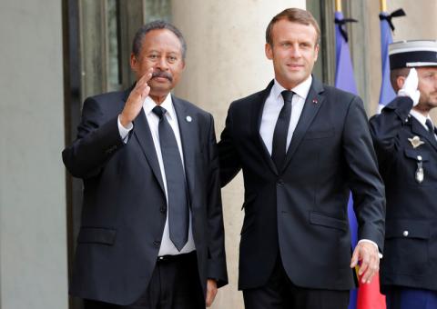 French President Emmanuel Macron welcomes Sudan's Prime Minister Abdalla Hamdok as he arrives for a meeting at the Elysee Palace in Paris, France, September 30, 2019. PHOTO BY REUTERS/Philippe Wojazer