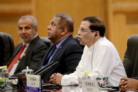 Sri Lankan President Maithripala Sirisena (Right) speaks as he meets Chinese President Xi Jinping at the Great Hall of the People on March 26, 2015 in Beijing, China. PHOTO BY REUTERS/Feng Li