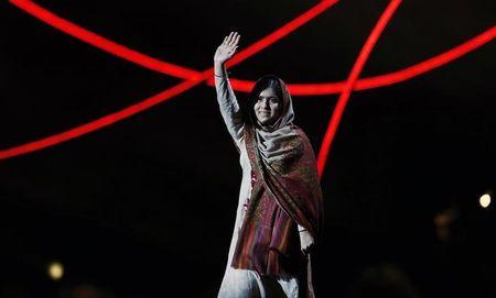 Nobel Peace Prize laureate Malala Yousafzai waves as she arrives on stage at the Nobel Peace Prize Concert in Oslo, December 11, 2014. PHOTO BY REUTERS/Suzanne Plunkett
