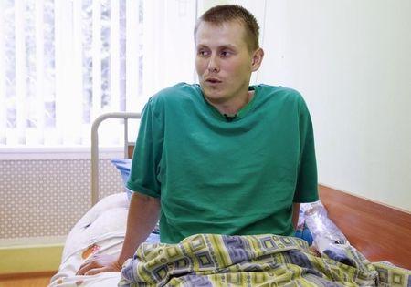 A man, according to Ukraine's state security service (SBU) named Alexander Alexandrov who is one of two Russian servicemen recently detained by Ukrainian forces, speaks during an interview with Reuters at a hospital in Kiev, Ukraine, May 28, 2015. PHOTO BY REUTERS/Valentyn Ogirenko