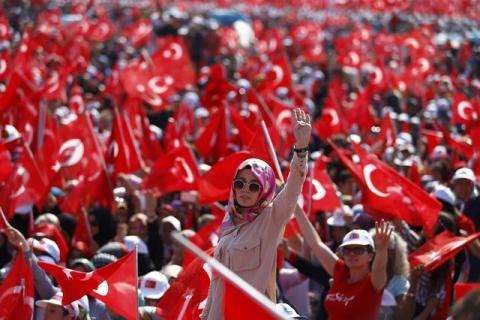A woman reacts as she attends the Democracy and Martyrs Rally, organized by Turkish President Tayyip Erdogan and supported by ruling AK Party (AKP), oppositions Republican People's Party (CHP) and Nationalist Movement Party (MHP), in Istanbul, Turkey, August 7, 2016. PHOTO BY REUTERS/Osman Orsal