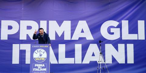 Italian Northern League leader Matteo Salvini speaks during a political rally with a banner reading "Italian first" in the back, in Milan, Italy February 24, 2018. PHOTO BY REUTERS/Tony Gentile