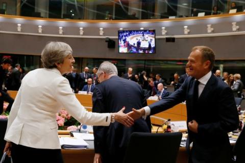 British Prime Minister Theresa May shakes hands with European Council President Donald Tusk at the EU summit in Brussels, Belgium, June 23, 2017. PHOTO BY REUTERS/Gonzalo Fuentes