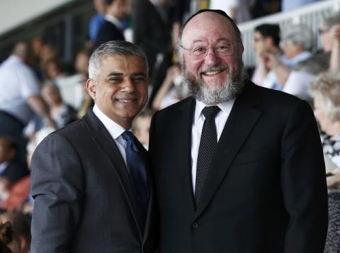 London's newly elected mayor Sadiq Khan (L) stands with Britain's Chief Rabbi Ephraim Mirvis at a holocaust commemoration ceremony at a rugby stadium in north London, May 8, 2016. PHOTO BY REUTERS/Peter Nicholls
