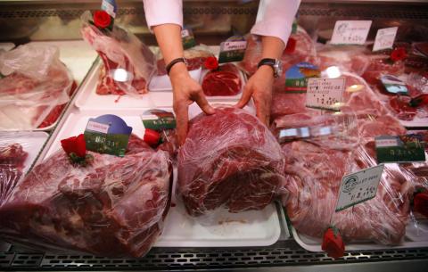 A butcher arranges pieces of meat at his shop in Marseille, France, October 27, 2015. PHOTO BY REUTERS/Jean-Paul Pelissier