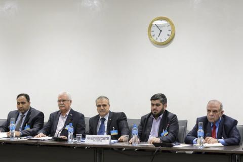 Members of the Syrian opposition delegation of the High Negotiations Committee (HNC) George Sabra (2nd L) delegation head Asaad Al-Zoubi (C) and Chief negotiator, Army of Islam rebel group's Mohammed Alloush (2nd R) attend a meeting with U.N. mediator on Syria Staffan de Mistura during Syria peace talks at the United Nations in Geneva, Switzerland, April 15, 2016. PHOTO BY REUTERS/Fabrice Coffrini