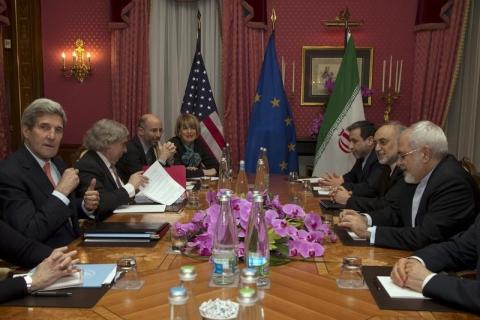 U.S. Secretary of State John Kerry (L) holds a negotiation meeting with Iran's Foreign Minister Mohammad Javad Zarif (R) over Iran's nuclear programme in Lausanne, March 19, 2015. PHOTO BY REUTERS/Brian Snyder
