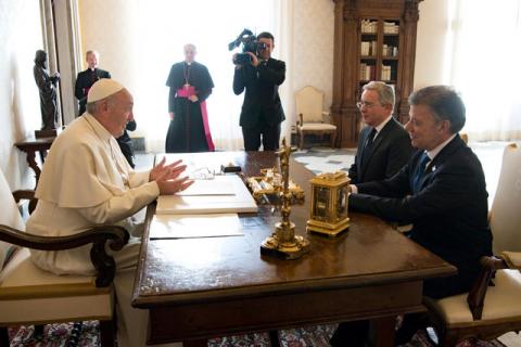 Pope Francis (L) meets Colombia's President Juan Manuel Santos (R) and former president Alvaro Uribe (C) at the Vatican, December 16, 2016. PHOTO BY Osservatore Romano