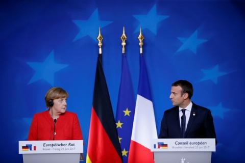 German Chancellor Angela Merkel and French President Emmanuel Macron addresses a joint news conference at the EU summit in Brussels, Belgium, June 23, 2017. PHOTO BY REUTERS/Gonzalo Fuentes