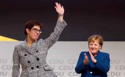 Annegret Kramp-Karrenbauer waves next to German Chancellor Angela Merkel after being elected as the party leader during the Christian Democratic Union (CDU) party congress in Hamburg, Germany, December 7, 2018. PHOTO BY REUTERS/Kai Pfaffenbach