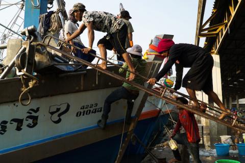 Migrant workers prepare for another fishing trip at a port in Samut Sakhon province, Thailand, January 22, 2018. PHOTO BY REUTERS/Athit Perawongmetha