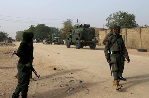 Nigerian military secure the area where a man was killed by suspected militants during an attack around Polo area of Maiduguri, Nigeria, February 16, 2019. PHOTO BY REUTERS/Afolabi Sotunde